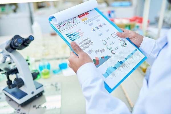 Scientist reviewing statistical data