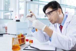 Young analytical chemist in action