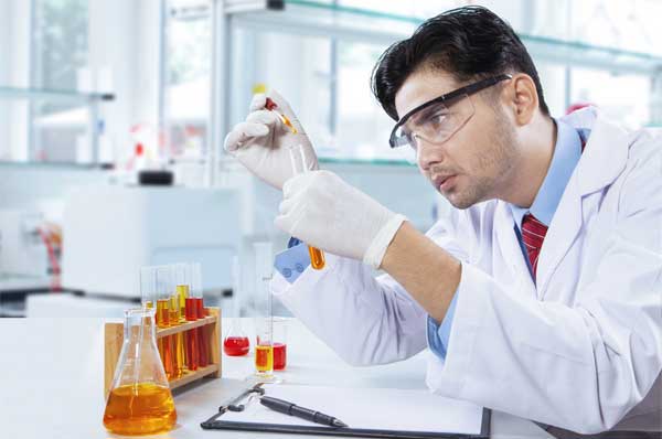 Young analytical chemist in action